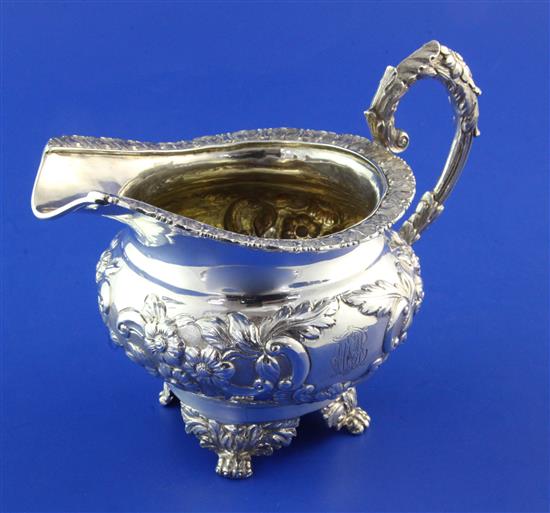 A Victorian silver circular cream jug, 10 oz.